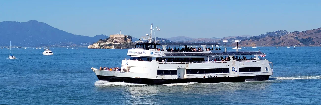The Alcatraz Clipper ferry with Alcatraz Island behind it