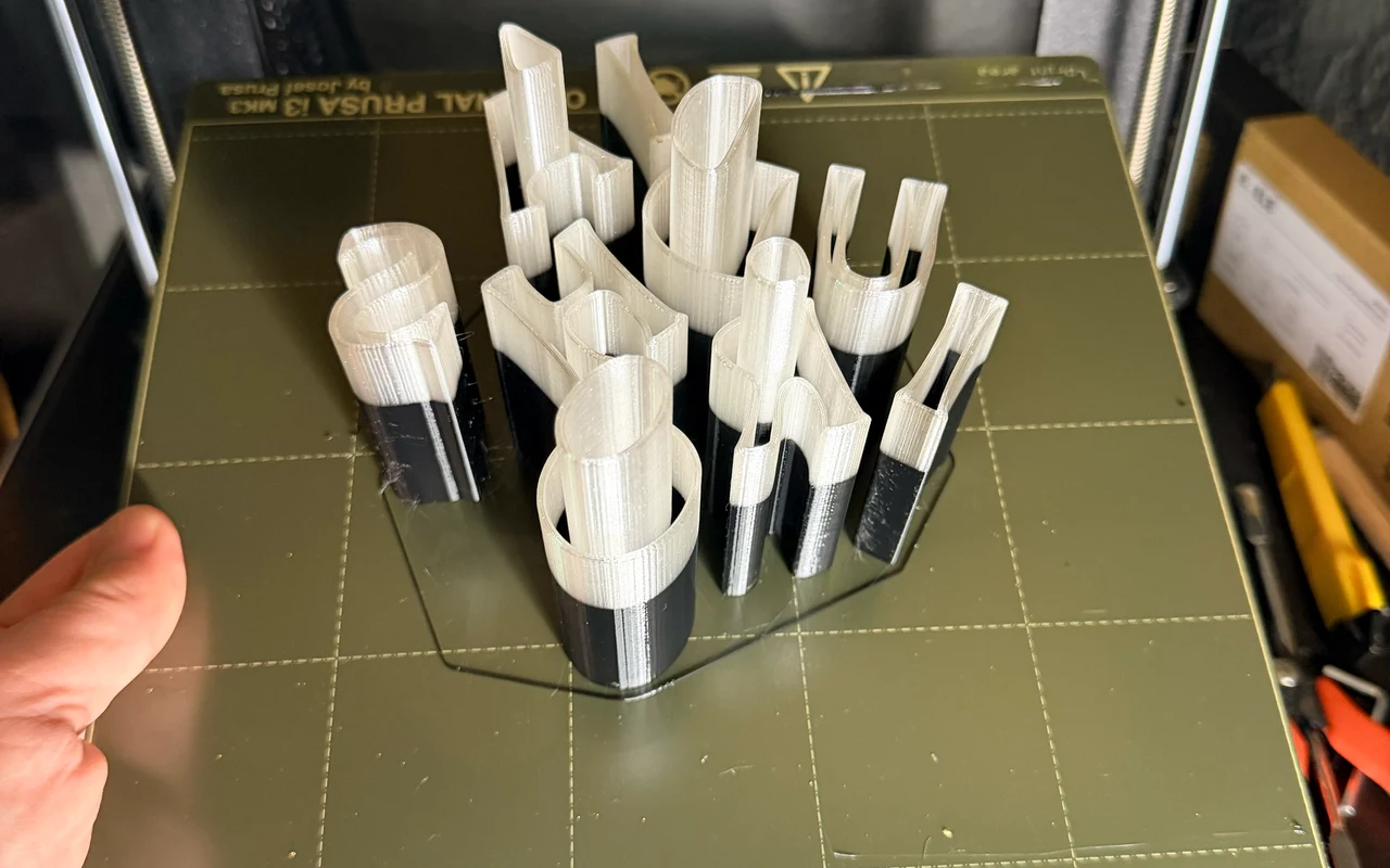 Freshly 3D-printed sign letters on a Prusa print bed